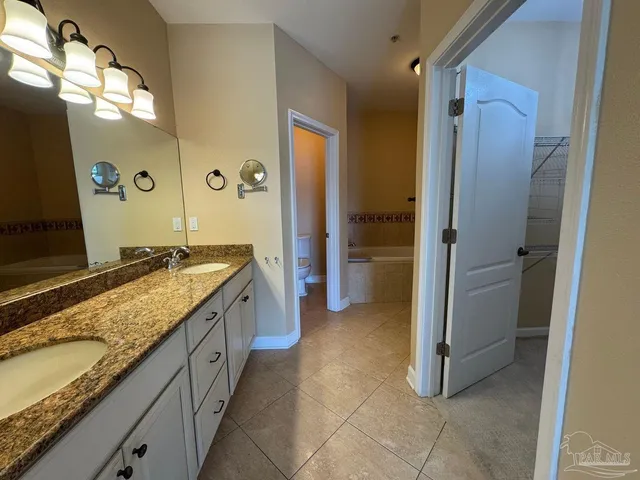 a bathroom with a sink a toilet and a bathtub