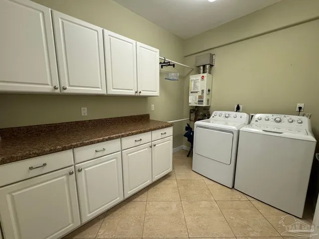 a spacious bathroom with a granite countertop sink mirror and a shower