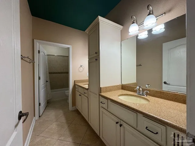 a bathroom with a toilet and a bathtub