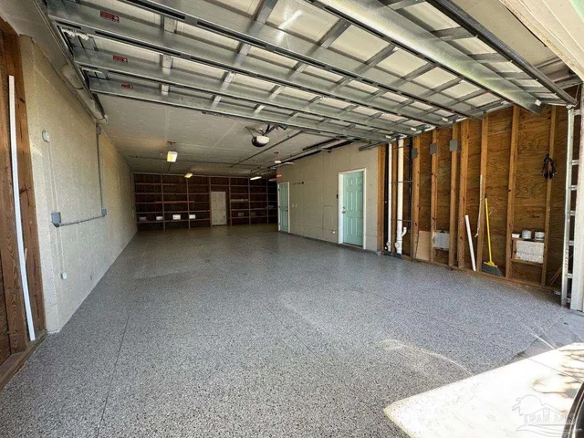 a view of parking garage with cars