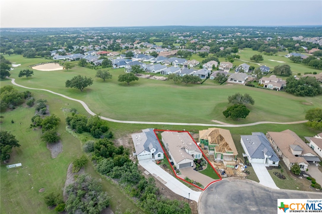 148 Limestone Drive Georgetown, TX 78628 - Photo 1 of 1 an aerial view of a house with a lake view