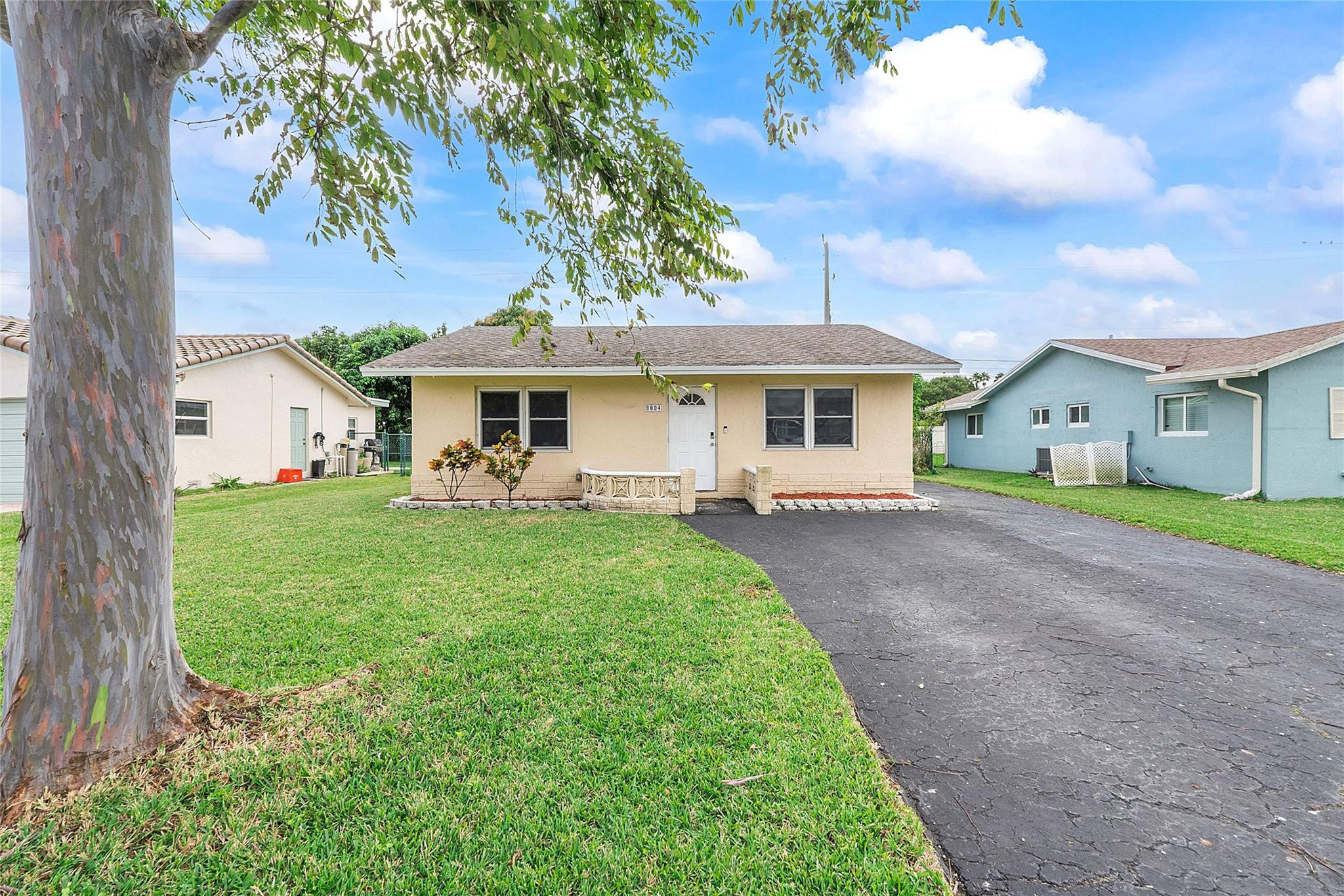 9804 Northwest 70th Street Tamarac, FL 33321 - Photo 12 of 12 a view of a house with a yard