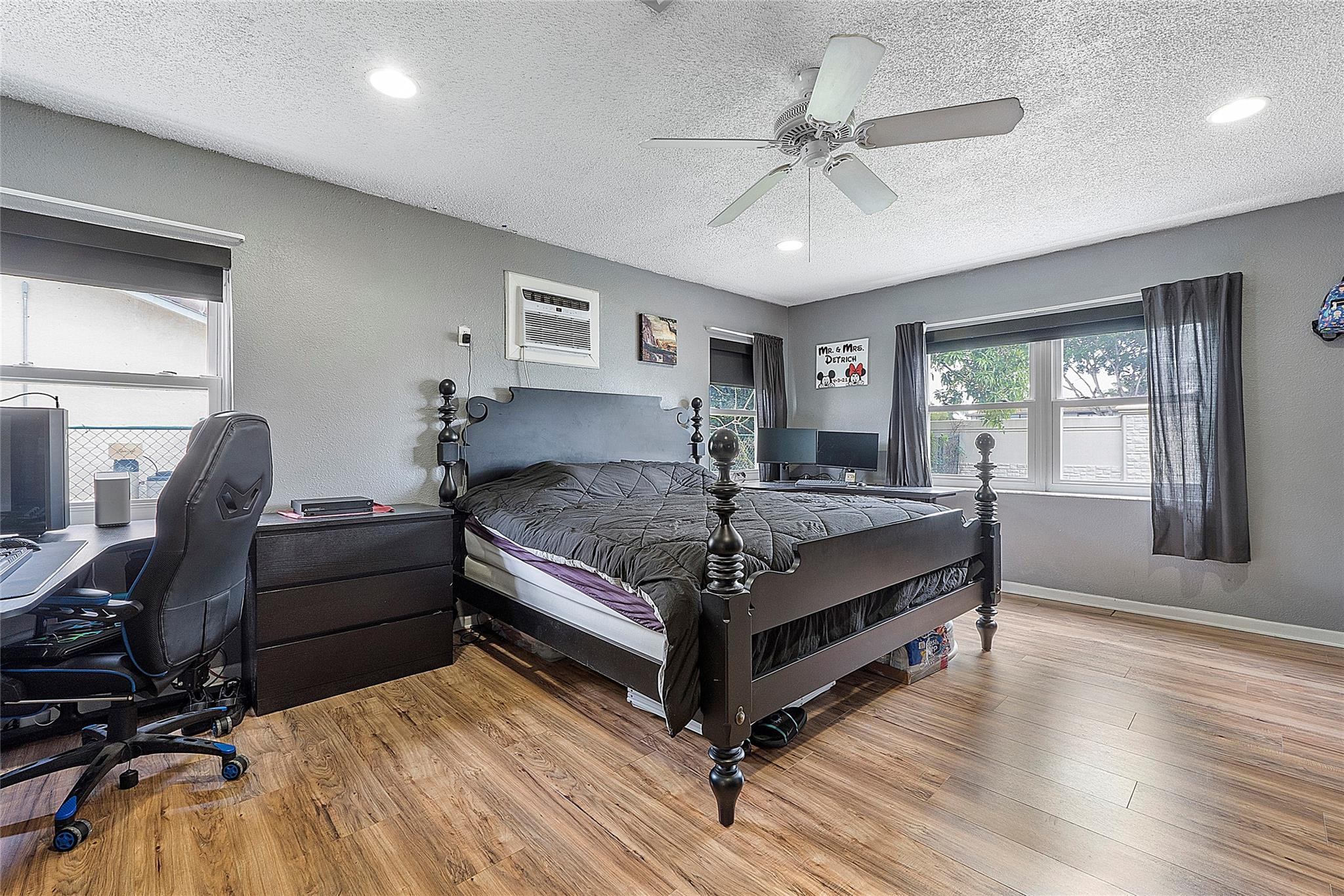 9804 Northwest 70th Street Tamarac, FL 33321 - Photo 6 of 12 a bedroom with a bed and window