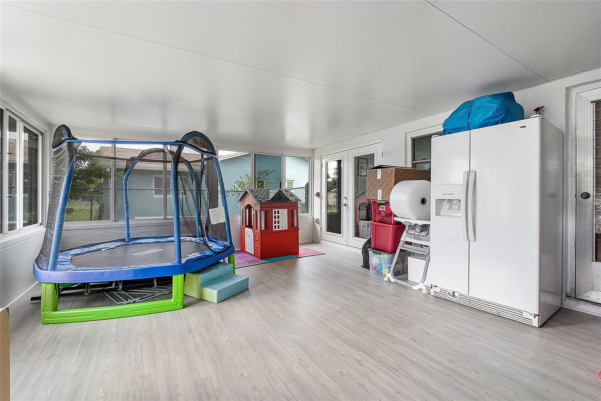 9804 Northwest 70th Street Tamarac, FL 33321 - Photo 9 of 12 a living room with furniture and a wooden floor