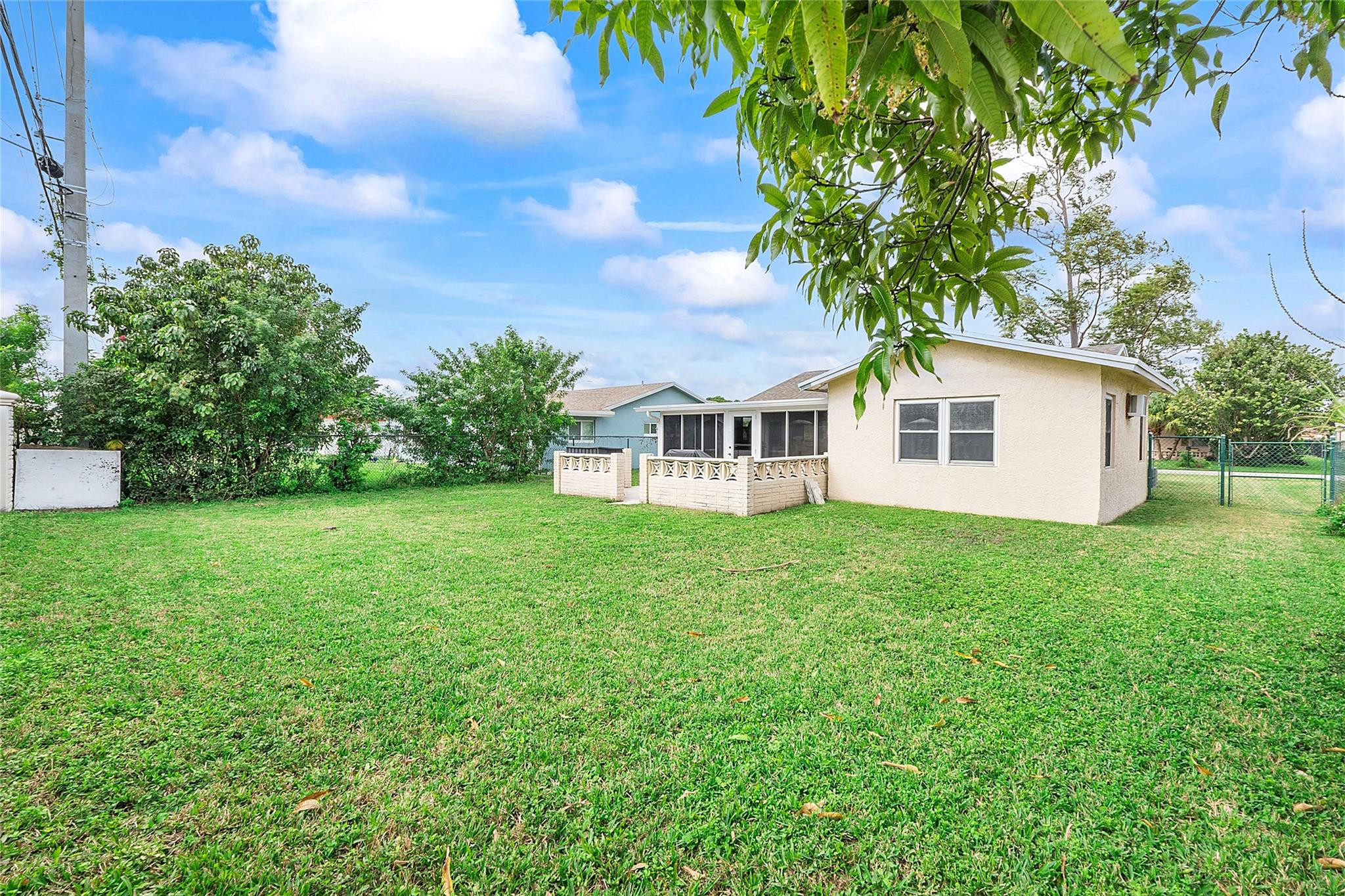 9804 Northwest 70th Street Tamarac, FL 33321 - Photo 10 of 12 a view of a house with backyard and garden