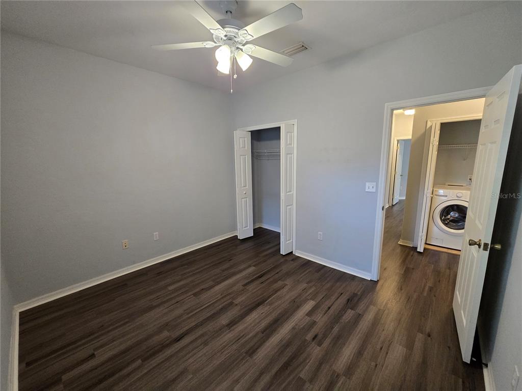 7976 48 Way Gainesville, FL 32653 - Photo 14 of 26 wooden floor in an empty room with a window