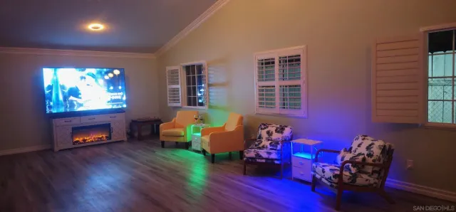 a bathroom with a sink vanity granite tub shower and a mirror