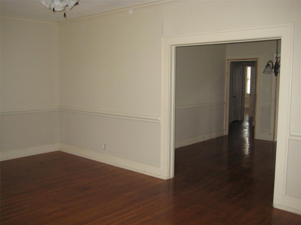3140 View Street Fort Worth, TX 76103 - Photo 13 of 21 an empty room with wooden floor and closet
