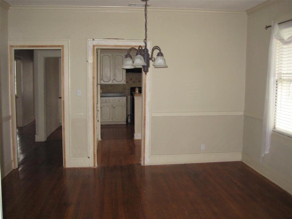 3140 View Street Fort Worth, TX 76103 - Photo 14 of 21 a view of a hallway with wooden floor and cabinet