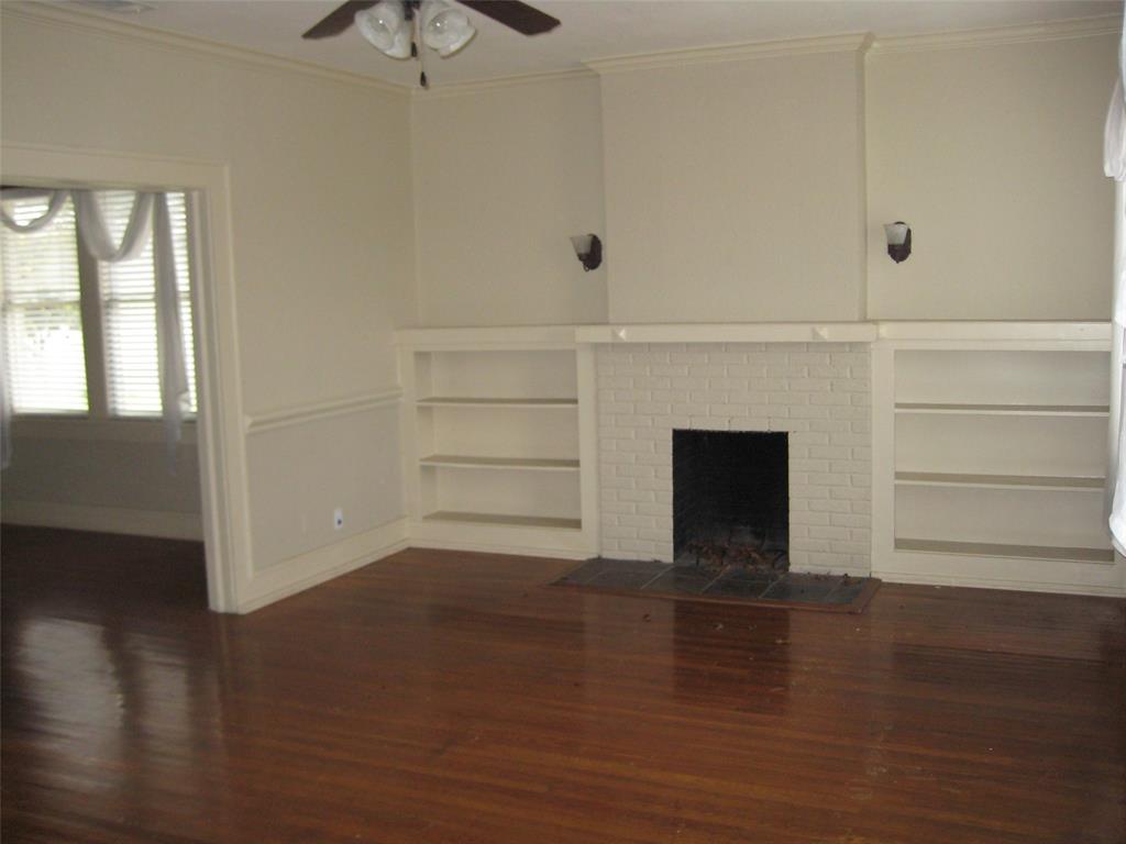 3140 View Street Fort Worth, TX 76103 - Photo 3 of 21 a view of empty room with wooden floor and fan
