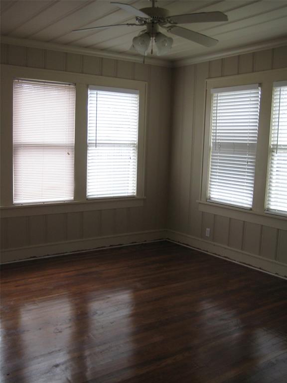 3140 View Street Fort Worth, TX 76103 - Photo 8 of 21 a view of an empty room with wooden floor and a window