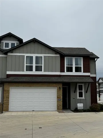a front view of a house with a garage