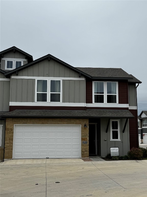 1020 Vista View Drive, Unit 2502 Georgetown, TX 78626 - Photo 1 of 15 View of front of home featuring board and batten siding, driveway, a shingled roof, and a garage