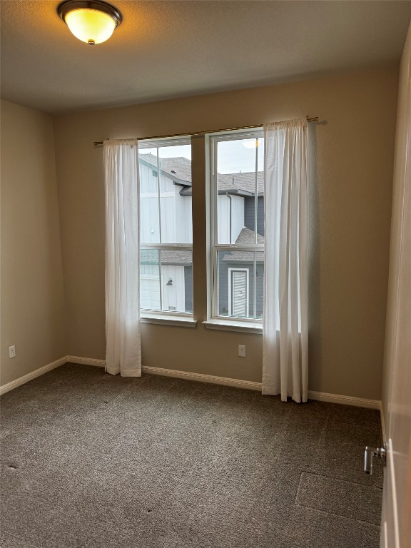 1020 Vista View Drive, Unit 2502 Georgetown, TX 78626 - Photo 9 of 15 Carpeted empty room with baseboards
