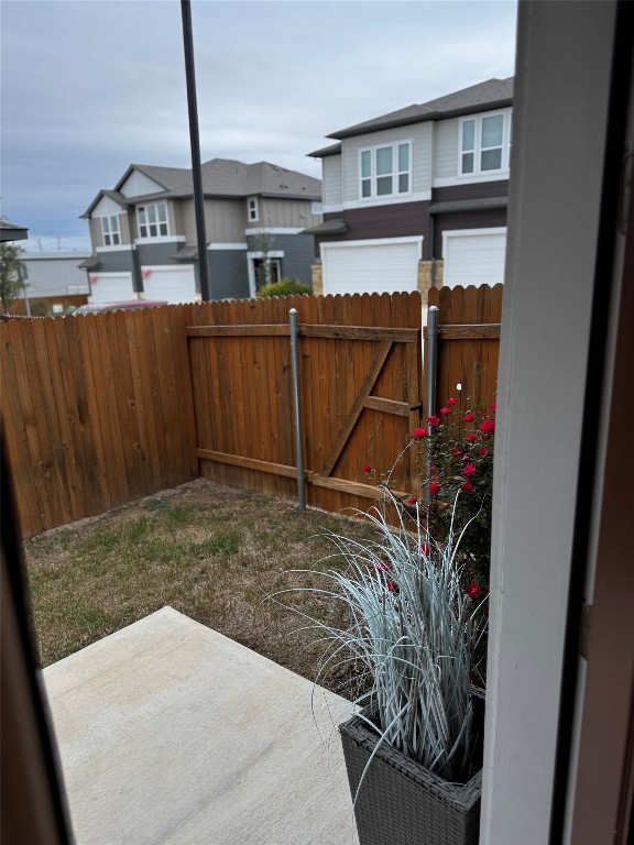 1020 Vista View Drive, Unit 2502 Georgetown, TX 78626 - Photo 5 of 15 Fenced backyard with a patio and a residential view