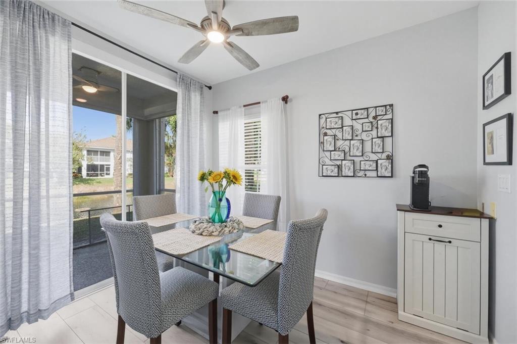 6899 Rain Lily Road, Unit 103 Naples, FL 34109 - Photo 14 of 39 Dining room with light wood-style flooring and a ceiling fan