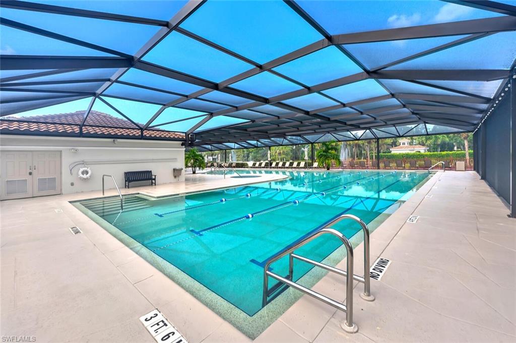 6899 Rain Lily Road, Unit 103 Naples, FL 34109 - Photo 32 of 39 Community pool with a patio and a lanai