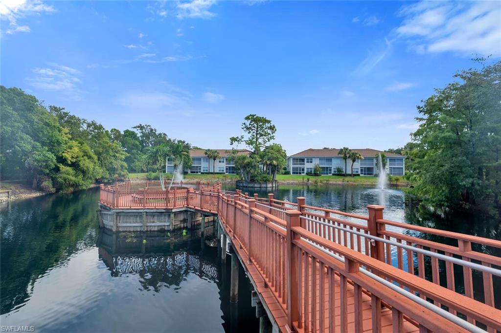 6899 Rain Lily Road, Unit 103 Naples, FL 34109 - Photo 34 of 39 Dock with a water view