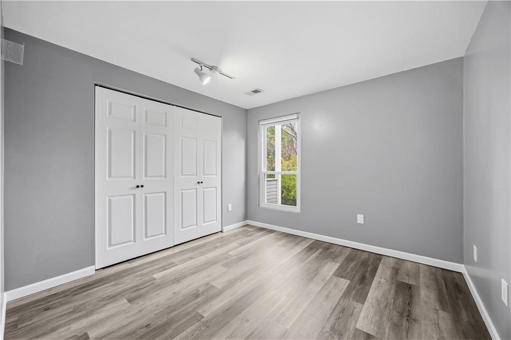 2212 Kenzie Road Pittsburgh, PA 15205 - Photo 15 of 36 wooden floor in an empty room with a window