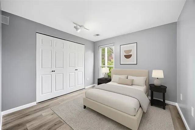 a bedroom with a bed and a window