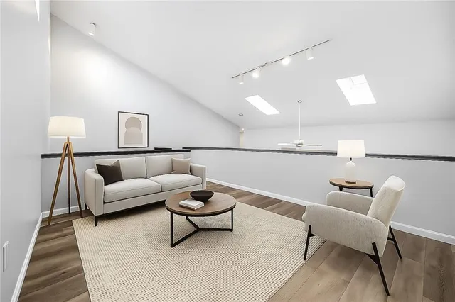 a living room with furniture and a rug