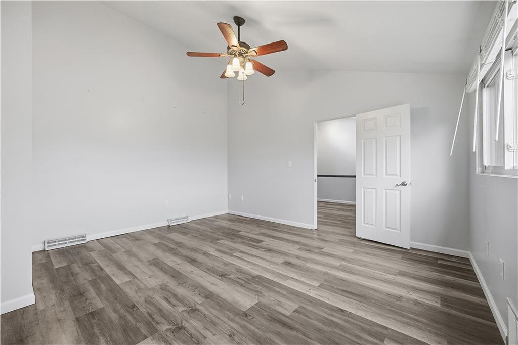 2212 Kenzie Road Pittsburgh, PA 15205 - Photo 27 of 36 wooden floor in an empty room with a window