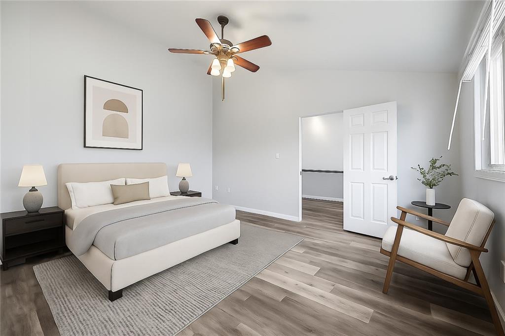 2212 Kenzie Road Pittsburgh, PA 15205 - Photo 28 of 36 a spacious bedroom with a bed and a chair