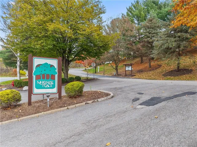 a sign board with parking space
