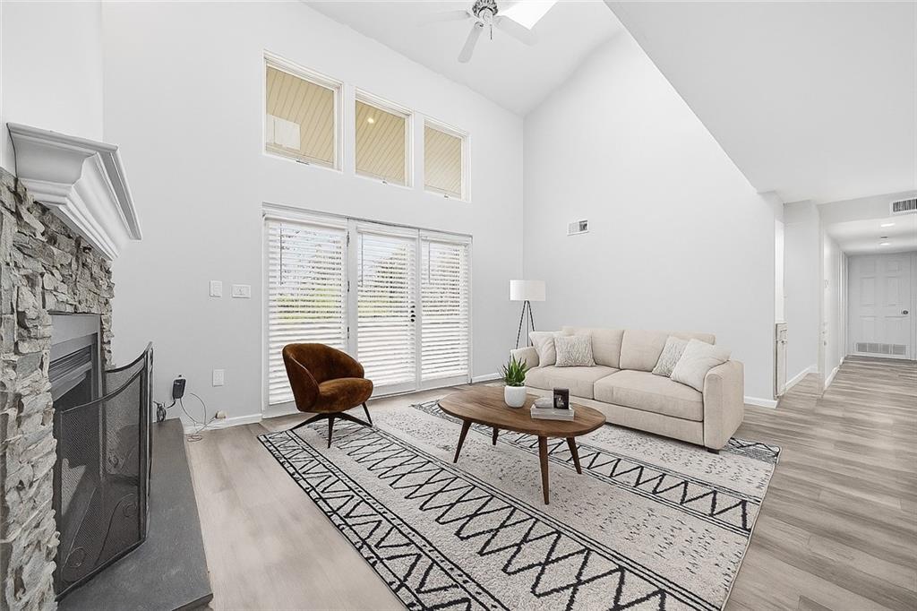 2212 Kenzie Road Pittsburgh, PA 15205 - Photo 5 of 36 a living room with furniture a fireplace and wooden floor