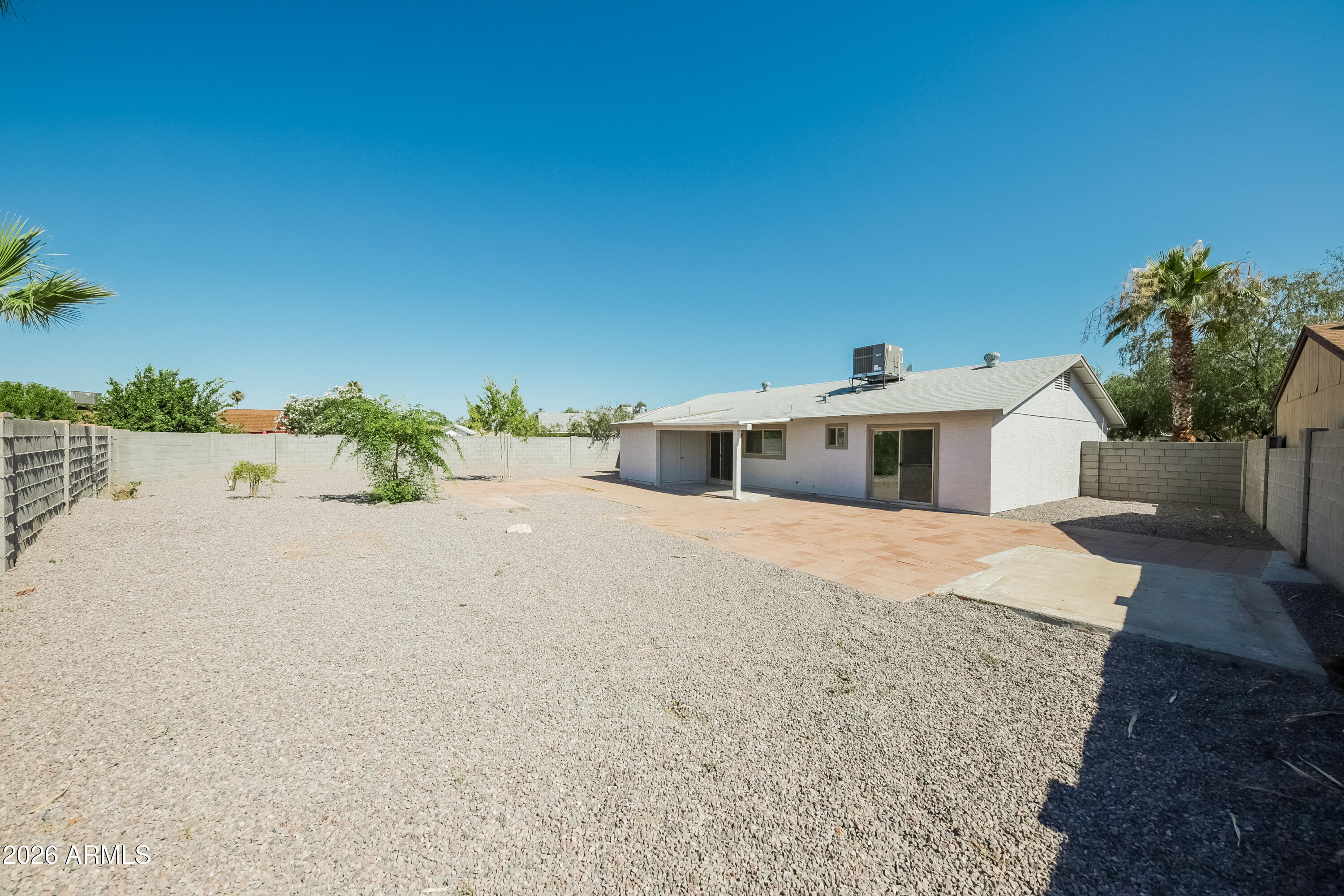 2501 East Villa Rita Drive Phoenix, AZ 85032 - Photo 3 of 15 a white house with a white fence
