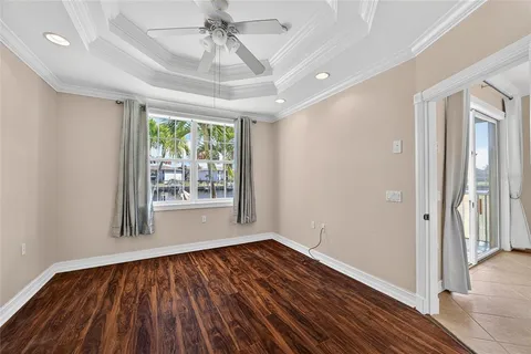 a bathroom with a granite countertop double vanity sink and a mirror