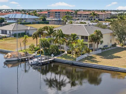 a view of a chair and tables in the patio