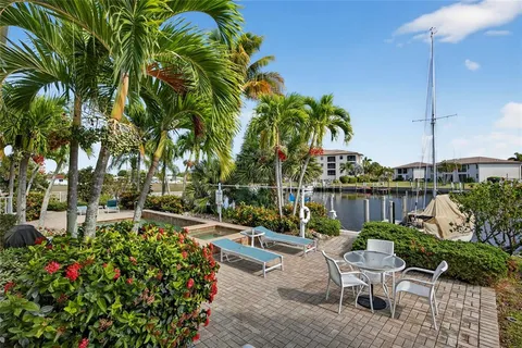 a view of a swimming pool with a patio and a garden