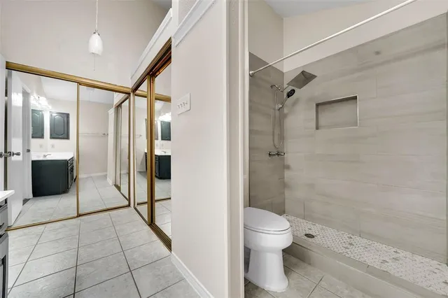 a bathroom with a shower and a toilet