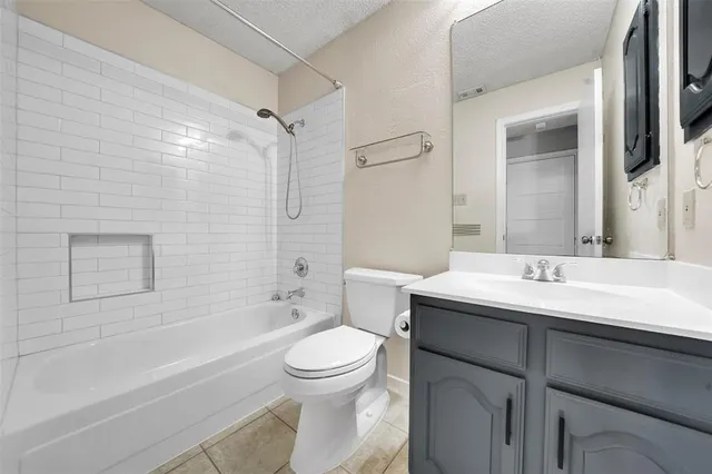 a bathroom with a sink toilet vanity and shower