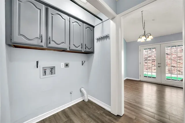 a view of a room with wooden floor and staircase