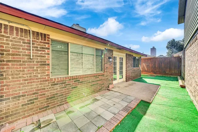 a view of house with backyard