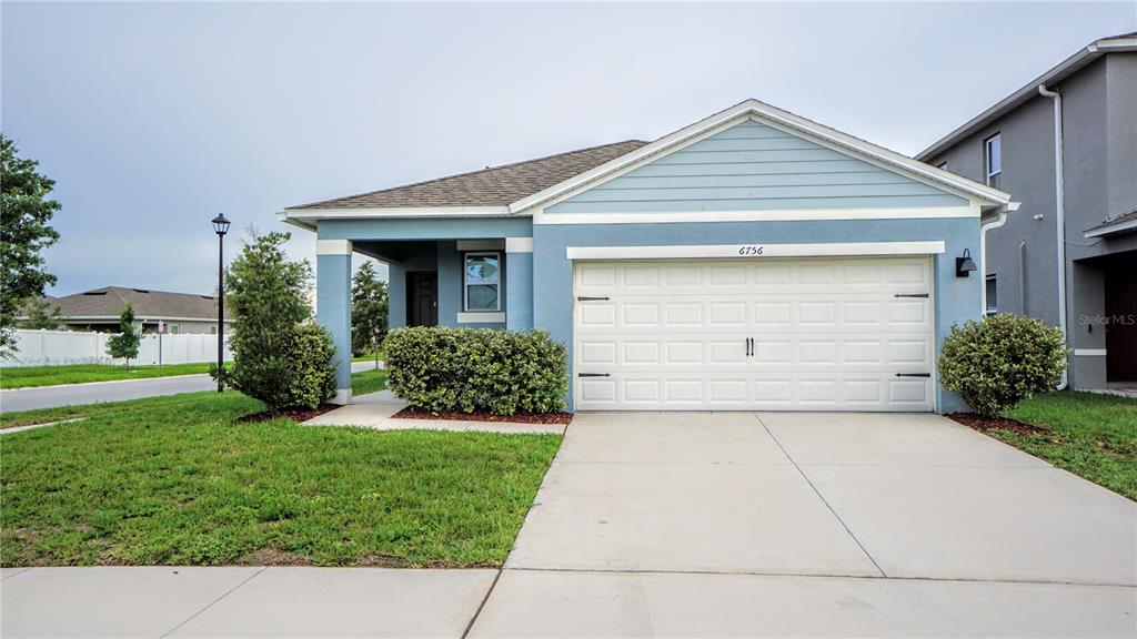 6756 Huntleigh Hammock Road Harmony, FL 34773 - Photo 1 of 1 a front view of house with yard