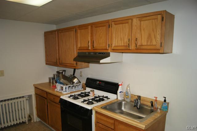 522 North Jordan Street Allentown, PA 18102 - Photo 5 of 11 a kitchen with a stove and a microwave
