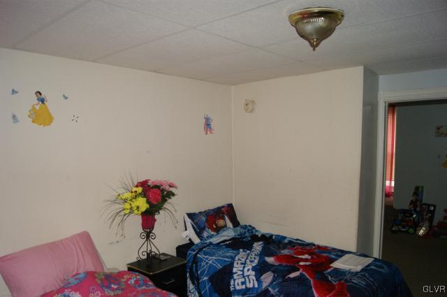 522 North Jordan Street Allentown, PA 18102 - Photo 10 of 11 a bedroom with a bed and a couch