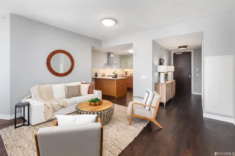 a living room with furniture and a table