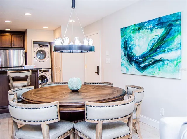 a kitchen with a table and chairs
