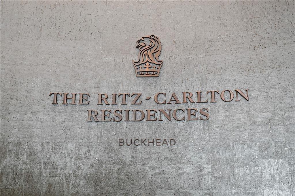 3630 Peachtree Road Northeast, Unit 2404 Atlanta, GA 30326 - Photo 28 of 48 a wall with a signage