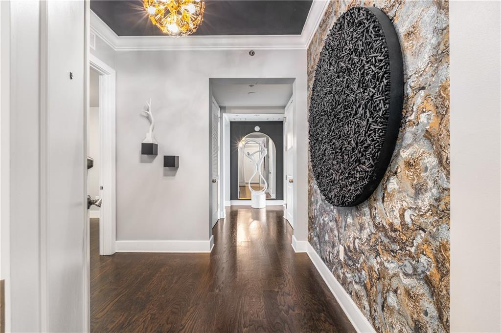 3630 Peachtree Road Northeast, Unit 2404 Atlanta, GA 30326 - Photo 3 of 48 wooden floor in an empty room with a fireplace