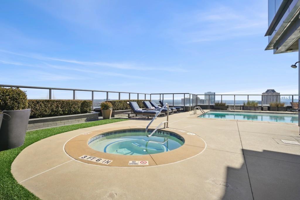 3630 Peachtree Road Northeast, Unit 2404 Atlanta, GA 30326 - Photo 34 of 48 a view of a swimming pool with a patio