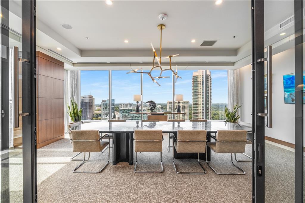 3630 Peachtree Road Northeast, Unit 2404 Atlanta, GA 30326 - Photo 36 of 48 a room with lots of tables and chairs