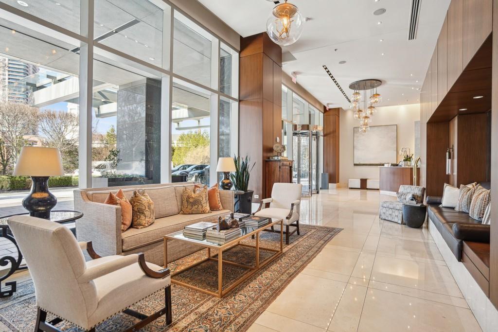 3630 Peachtree Road Northeast, Unit 2404 Atlanta, GA 30326 - Photo 37 of 48 a living room with furniture and a large window
