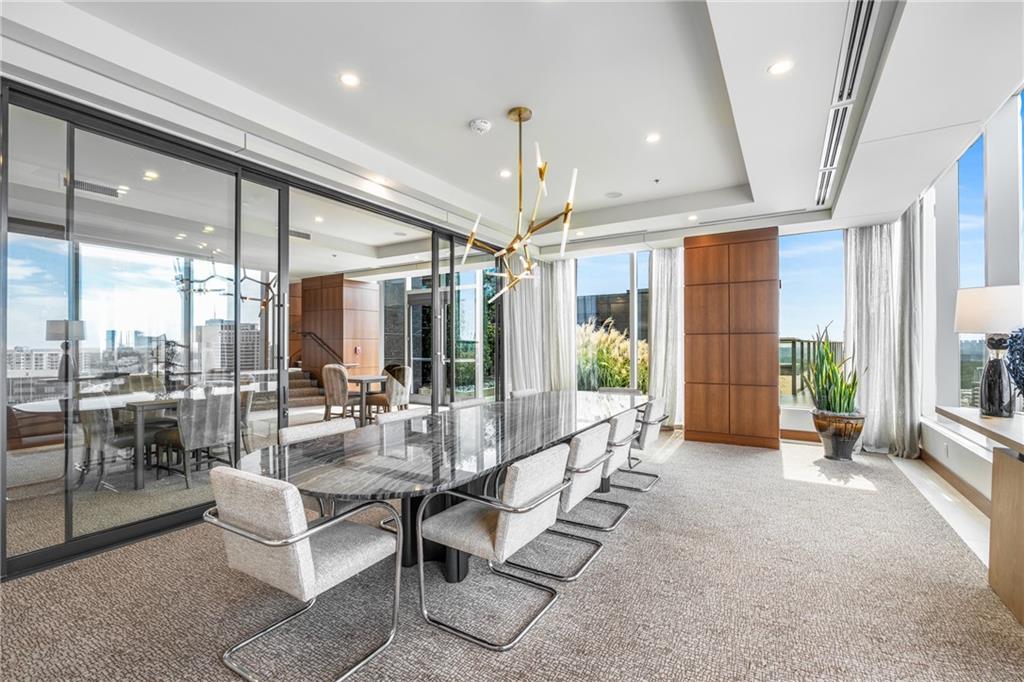 3630 Peachtree Road Northeast, Unit 2404 Atlanta, GA 30326 - Photo 38 of 48 a large living room with large windows