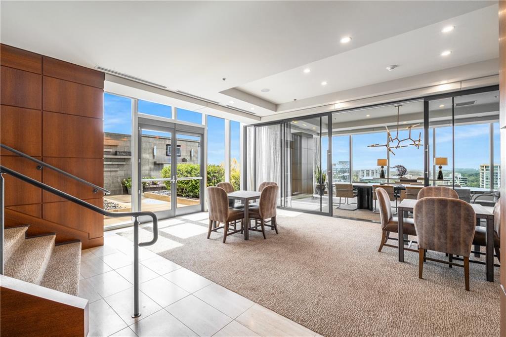 3630 Peachtree Road Northeast, Unit 2404 Atlanta, GA 30326 - Photo 40 of 48 a living room with furniture and large windows