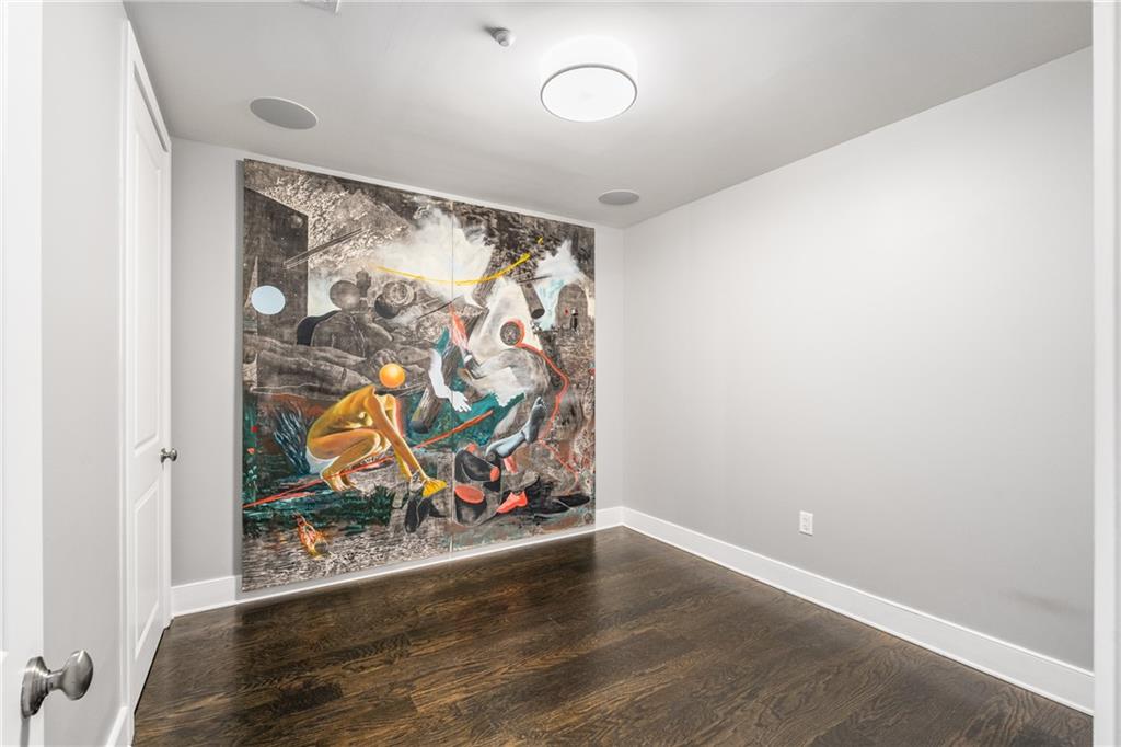 3630 Peachtree Road Northeast, Unit 2404 Atlanta, GA 30326 - Photo 4 of 48 an empty room with painting on the wall and a window